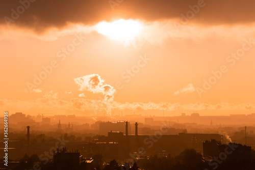 Obraz na płótnie Beautiful orange sunset over the city of Ryazan in summer. Far away smoke from the factory in the rays of sunset w salonie