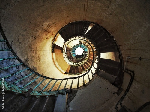 old spiral staircase in abandoned lighthouse