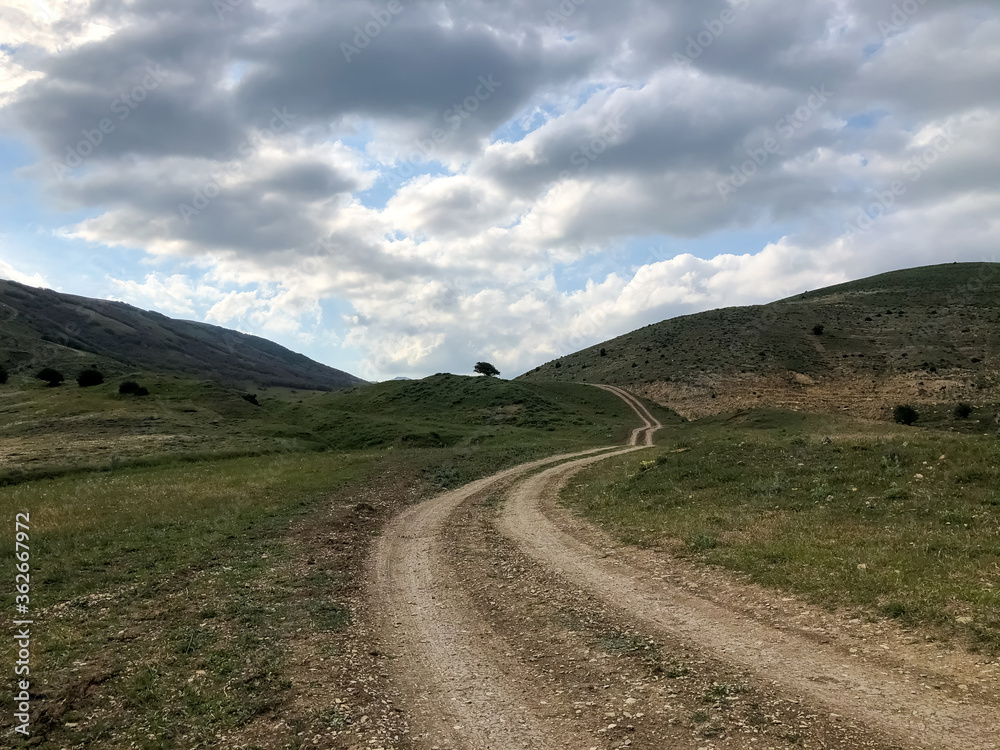 road in the mountains, landscape with mountains and clouds