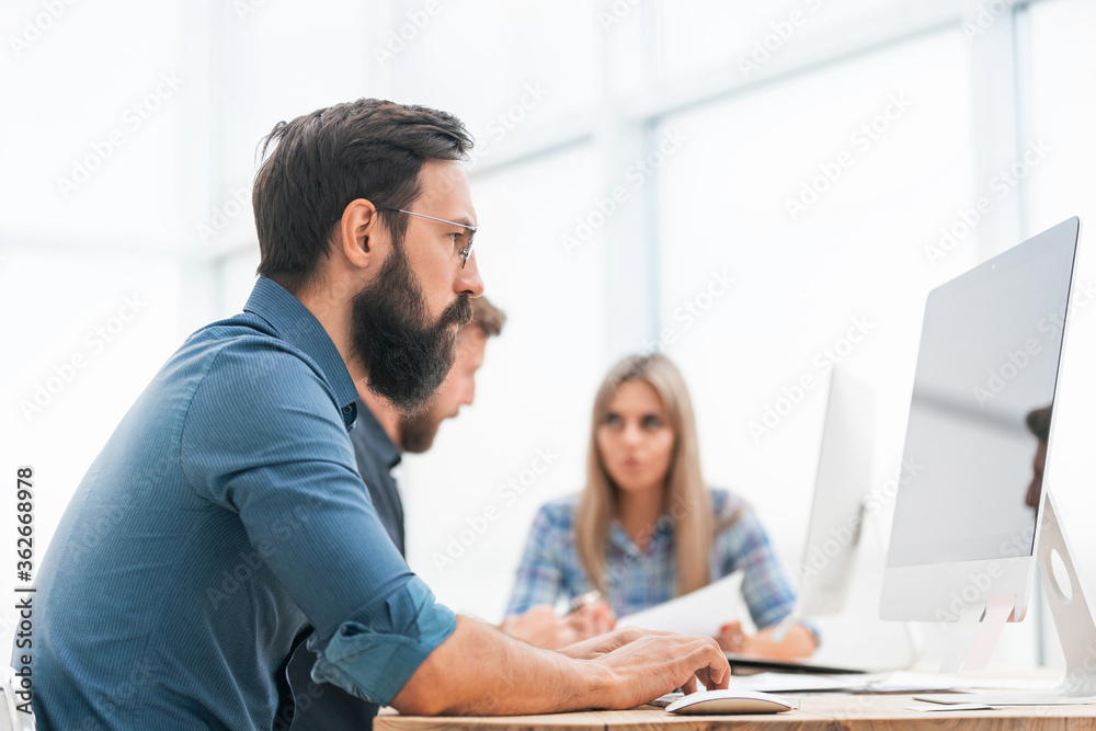 businessman uses a computer to work with documents businessman uses a computer to work with documents