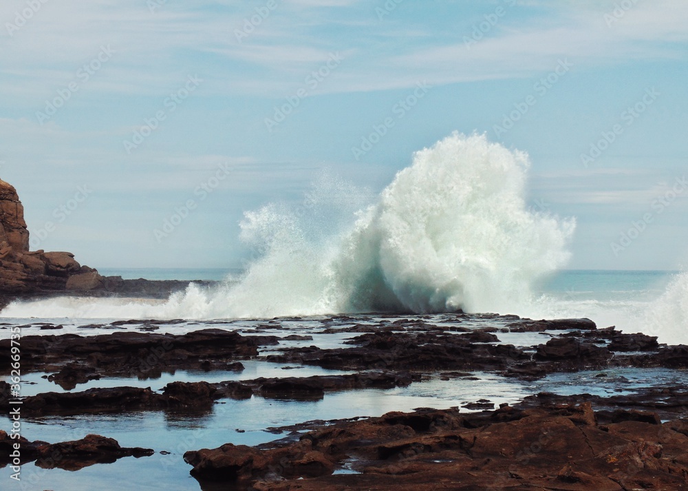 waves crashing on rocks