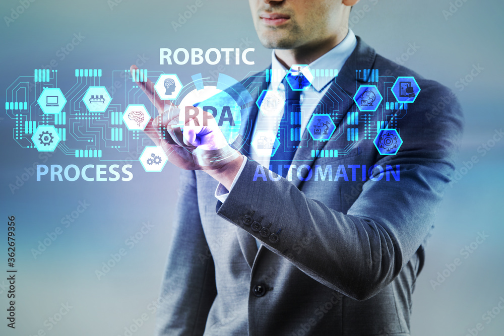 Businessman pressing buttons in RPA concept Businessman pressing buttons in RPA concept