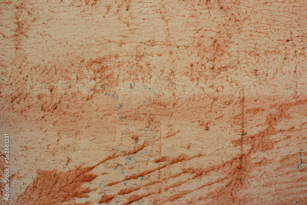 Roughly painted wall with orange paint. Beautiful abstract grunge decorative navy orange plaster wall background. The art of rough stylized texture banner with space for text. Roughly painted wall with orange paint. Beautiful abstract grunge decorative navy orange plaster wall background. The art of rough stylized texture banner with space for text.
