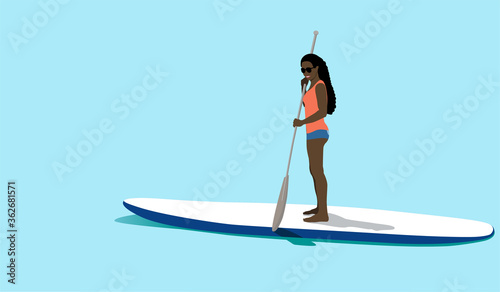African woman standing on sup board
