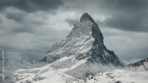 view to the majestic Matterhorn mountain in front of cloudy sky