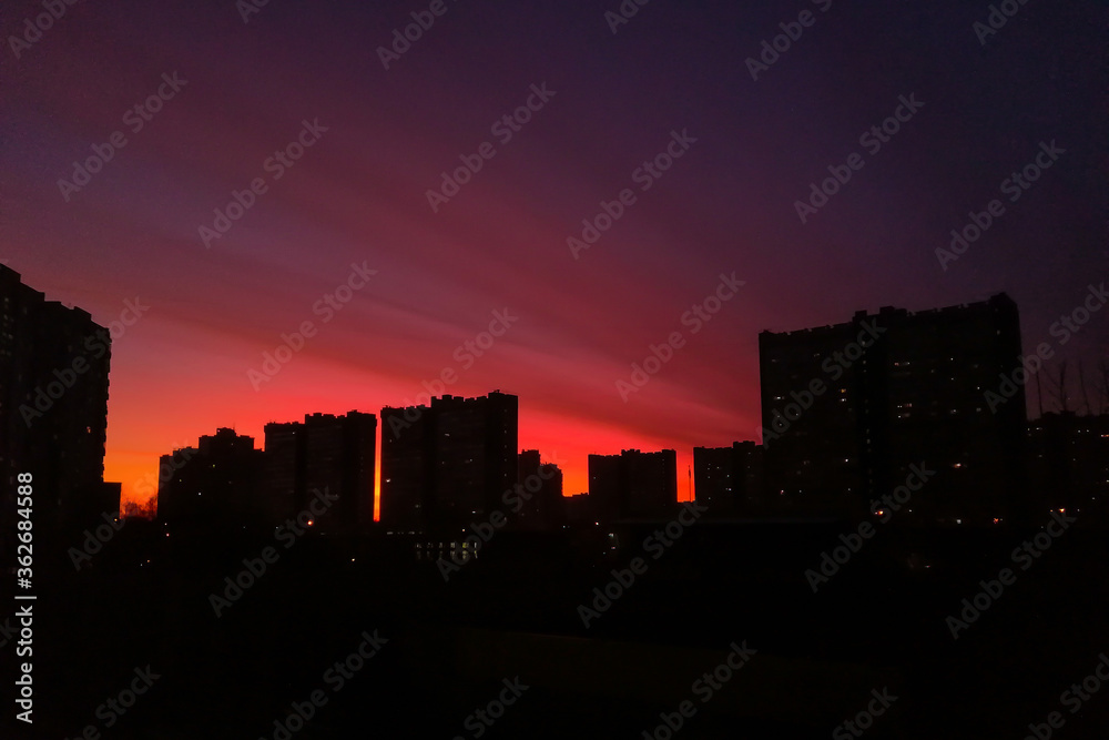 Scarlet sunset in blocks of flats background in Moscow