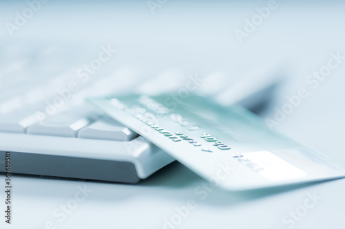 Bank creadit card on keyboard. Concept of online banking and internet purchase.