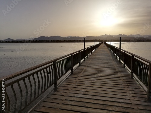 wooden pier at sunset