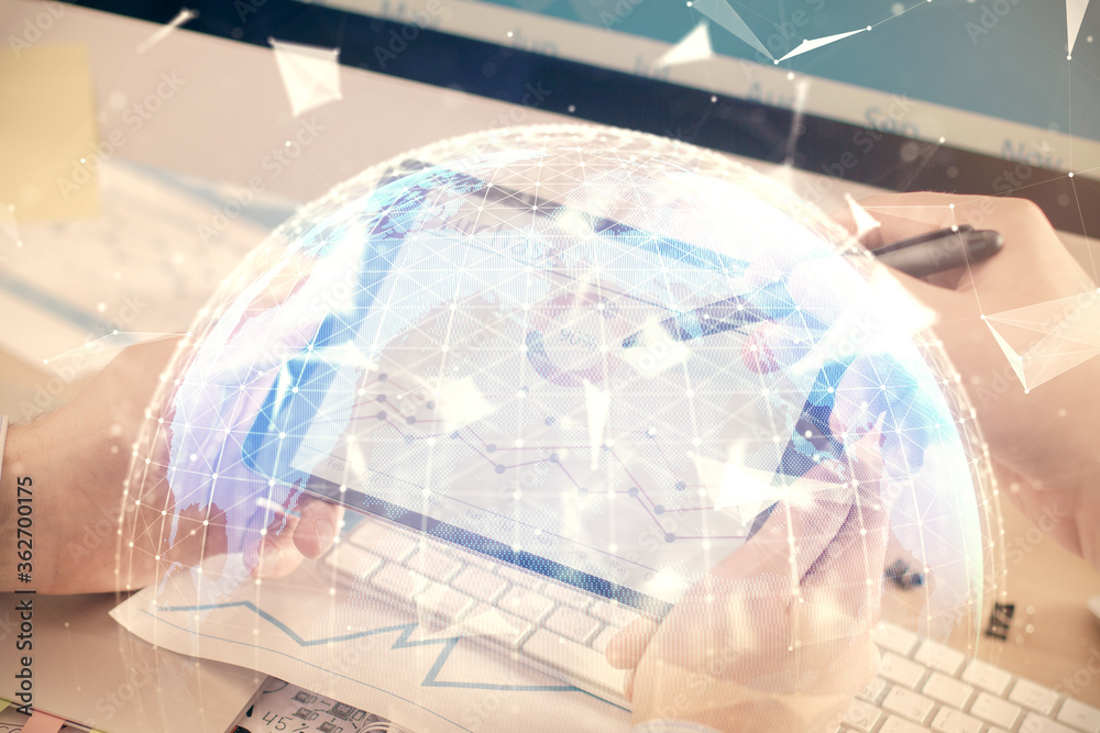 Double exposure of man's hands holding and using a phone and international business theme drawing. Double exposure of man's hands holding and using a phone and international business theme drawing.
