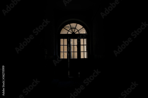 ancient arch shape door way in old house hall inside space black background indoor environment architecture indoor