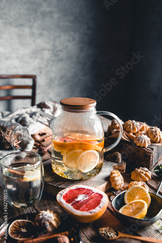 Hot tea with slices of fresh grapefruit on wooden tablet. Healthy drink  Eco  vegan