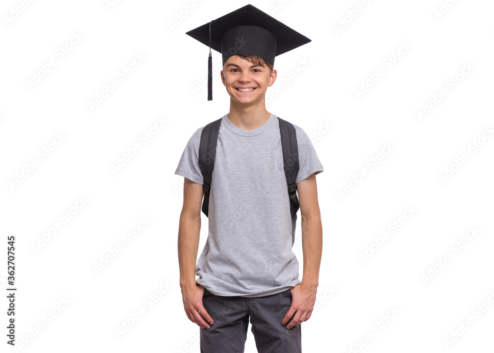 Young graduate student - Happy teen boy in bachelor hat with backpack, isolated on white background. Smiling child In Corner-Cap looking at camera. Teenager guy in Graduation Cap Back to school. Young graduate student - Happy teen boy in bachelor hat with backpack, isolated on white background. Smiling child In Corner-Cap looking at camera. Teenager guy in Graduation Cap Back to school.