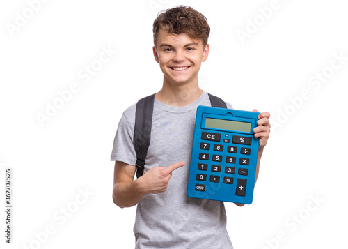 Smart student with backpack holding big calculator. Portrait of funny cute teen boy, isolated on white background. Happy child Back to school.