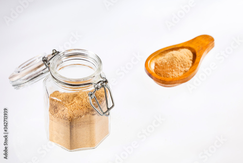 Organic maca root powder in glass jar - Lepidium meyenii