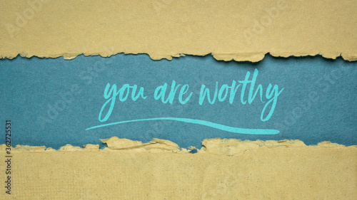 you are worthy inspirational note - handwriting on a handmade rag paper, positive affirmation, self confidence and personal development concept photo