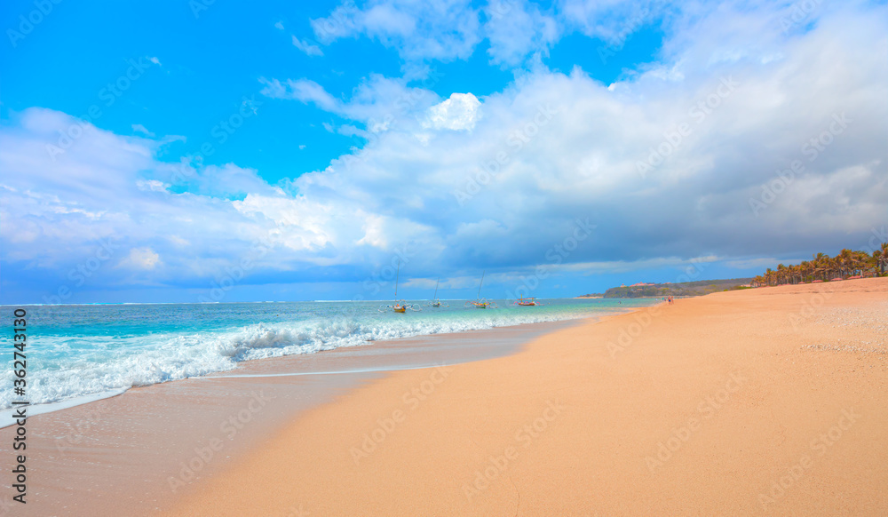 Empty tropical sandy beach and clear sea background - Bali, Indonesia Empty tropical sandy beach and clear sea background - Bali, Indonesia