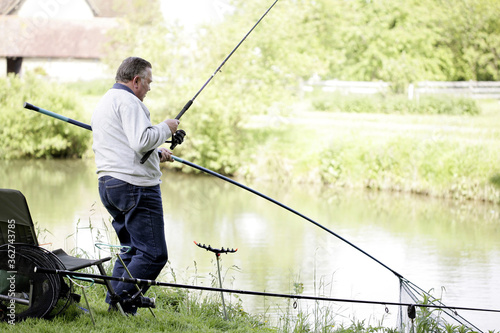 Senior man fishing by the river