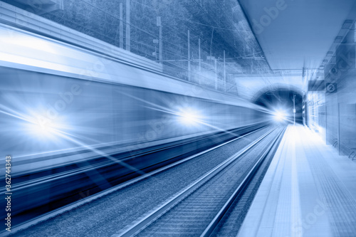 High speed train runs on rail tracks . Train in motion.