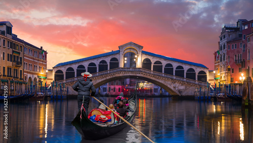 Romantic gondola ride near Rialto Bridge - Venice, Italy