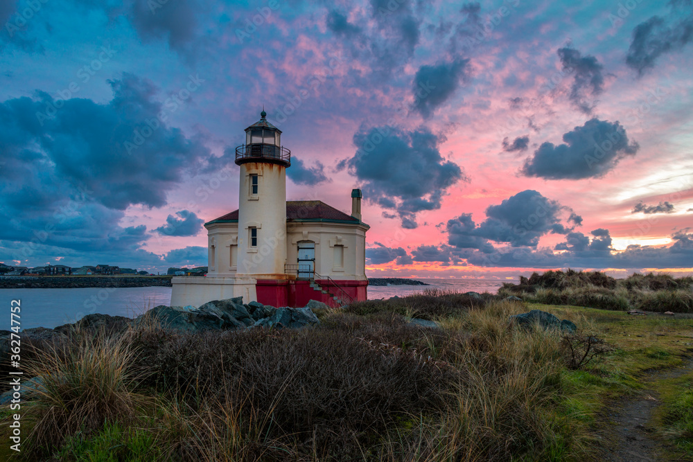 Dramatic evening sky with clouds over Oregon Lighthouse Dramatic evening sky with clouds over Oregon Lighthouse