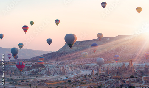 Hot air balloon flying over spectacular Cappadocia - Goreme, Turkey