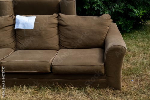 Free Couch on a Curbside Lawn