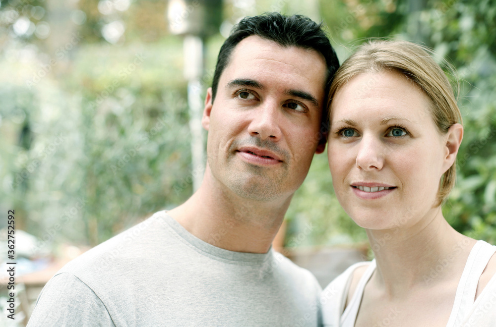 Fototapeta premium Couple smiling while looking up