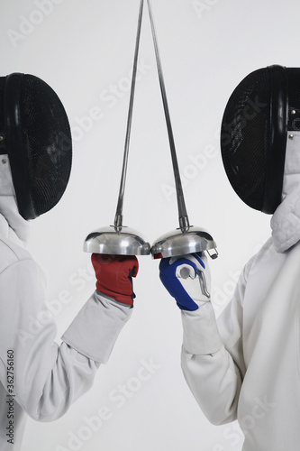 Obraz na plátně Two men in fencing suits in a duel