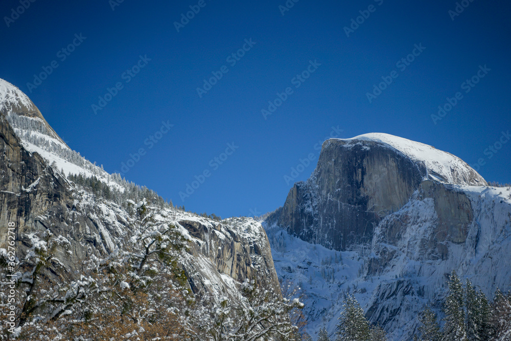  Half Dome at Yosemite Valley in the winter with white snow covering the top