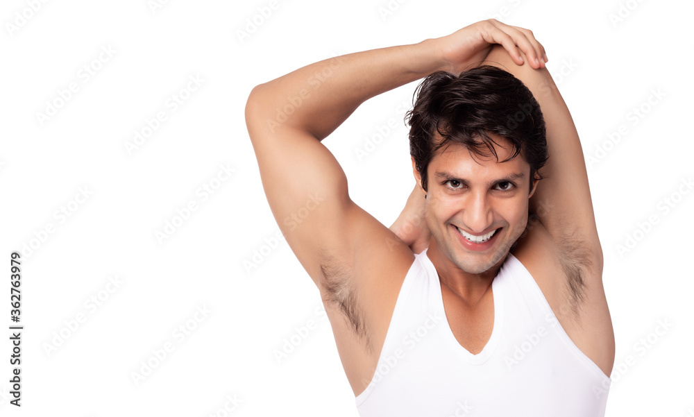 Young man stretching arms, shoulder body Handsome guy has good flexibility of  body, muscle and tendon. He get triceps stretch for cool down after workout with smile face. isolated on white copy space