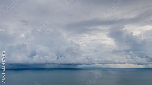 Beautiful aerial view of a Strong rain storm in the middle of the ocean  near the beach of Costa Rica