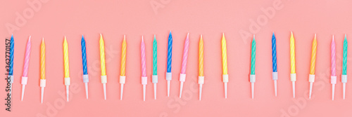 Happy birthday candles on pink background, top view. Flat lay style. Mockup, template. Horizontal long banner for web design