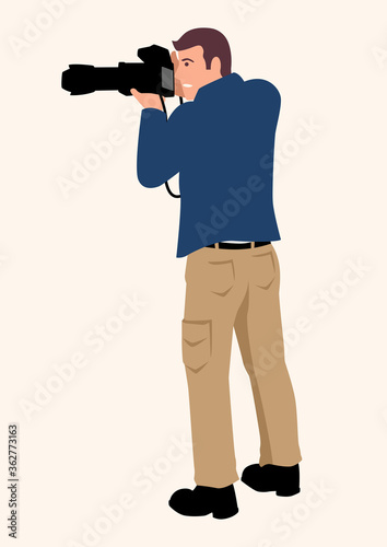 Man using a professional DSLR camera with tele lens