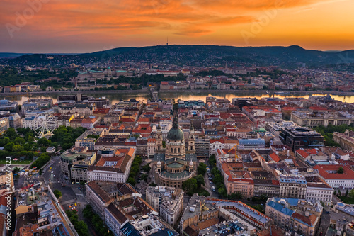Budapest, Hungary - Aerial panoramic view of Budapest with a magnificent golden sunset. The view includes St.Stephen's Basilica, Szechenyi Chain Bridge and ferris wheel at Elisabeth Square at summer