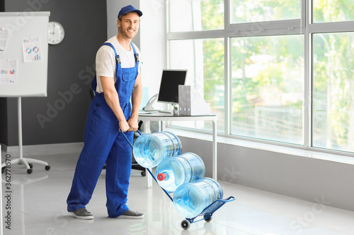 Delivery man with bottles o...