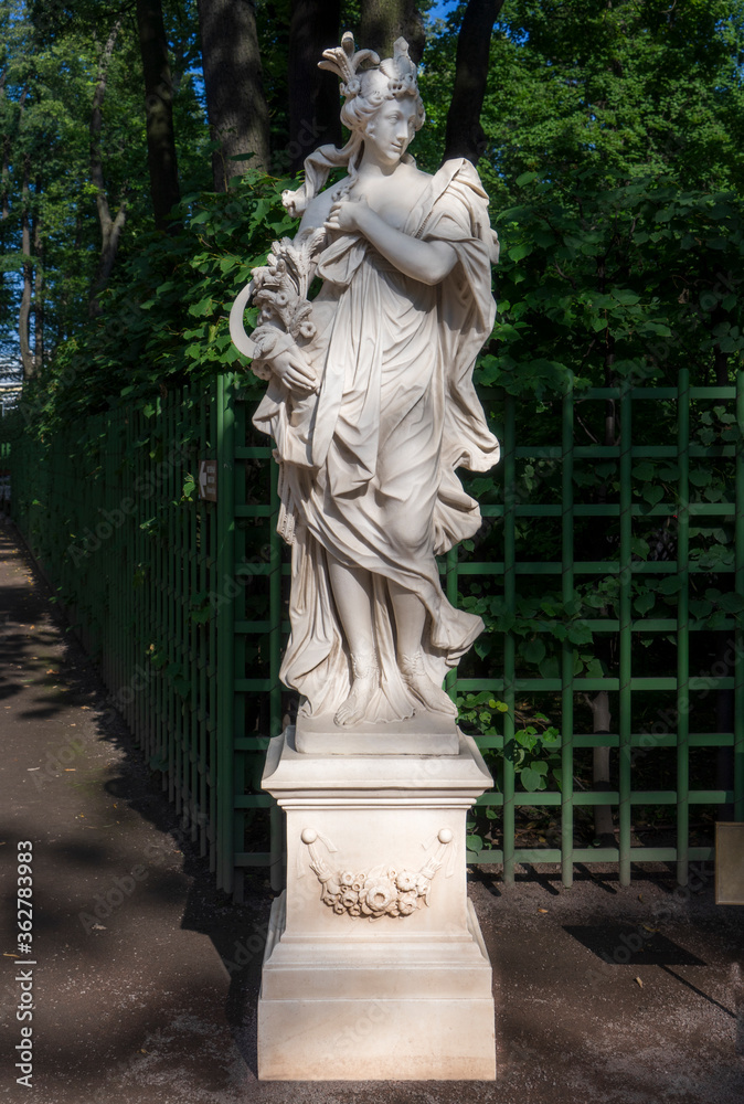 Summer Garden, Saint-Petersburg, Russia - July 28, 2019: Marble Sculpture of the Roman goddess Flora (in Greek mythology Chloris) by Heinrich Meiring (Arrigo Merengo; Enrico Merengo), Italy, 1717. 