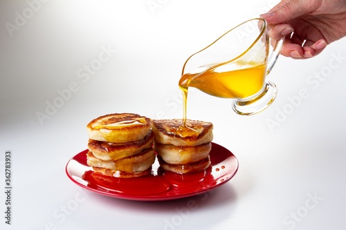 Honey syrup on pancake, del...