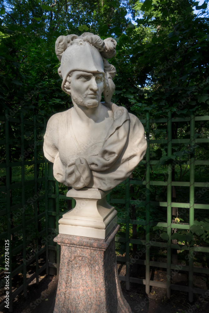 Saint-Petersburg, Russia - July 28, 2019: Marble Sculpture of the Roman god of war Mars (in Greek mythology Ares) by Orazio Marinali, Italy, 1717. Summer Garden, St. Petersburg, Russia. Saint-Petersburg, Russia - July 28, 2019: Marble Sculpture of the Roman god of war Mars (in Greek mythology Ares) by Orazio Marinali, Italy, 1717. Summer Garden, St. Petersburg, Russia.