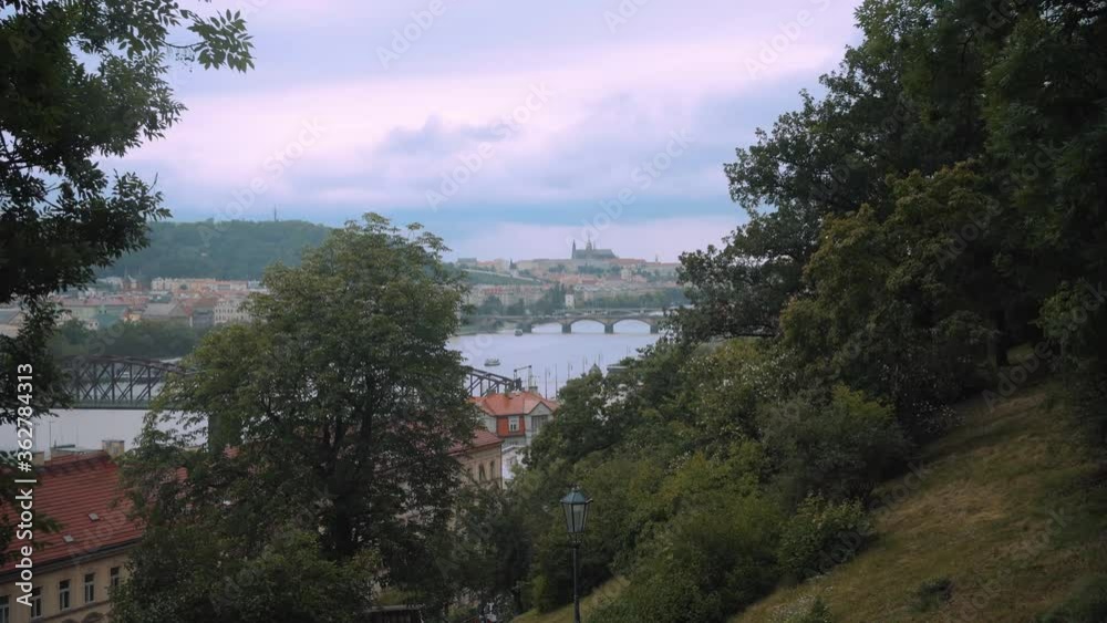 First person perspective of walking down stairs with a view over Prague river, Charles bridge and Prague Castle from Vysehrad, czechia First person perspective of walking down stairs with a view over Prague river, Charles bridge and Prague Castle from Vysehrad, czechia