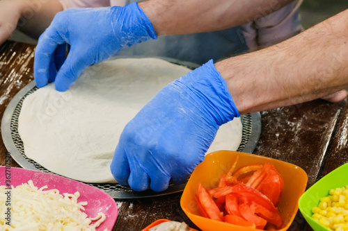 Cooking homemade Pizza on a...