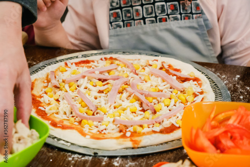 Cooking homemade Pizza on a...