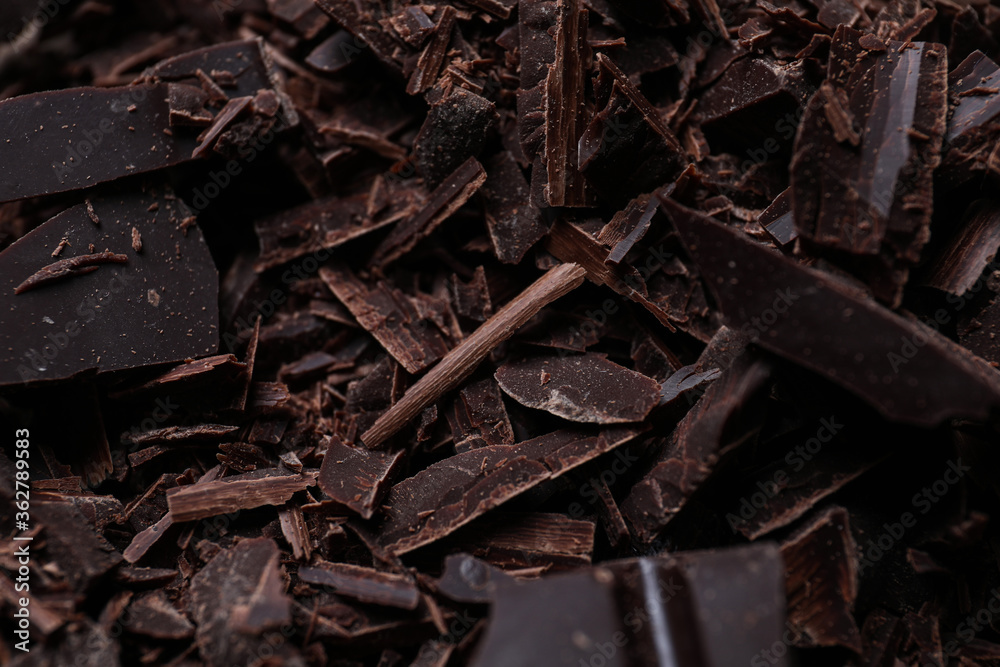 Tasty crushed dark chocolate as background, closeup Tasty crushed dark chocolate as background, closeup
