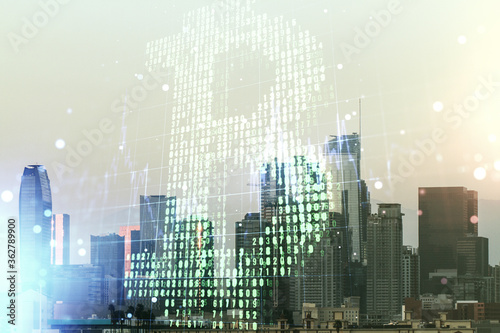 Double exposure of creative Bitcoin symbol hologram on Los Angeles office buildings background. Mining and blockchain concept