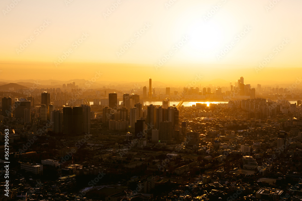 Downtown Seoul and the Han river at sunset, with skyscrapers and a layer of fine dust pollution, viewed from the Namsan Tower, 2018