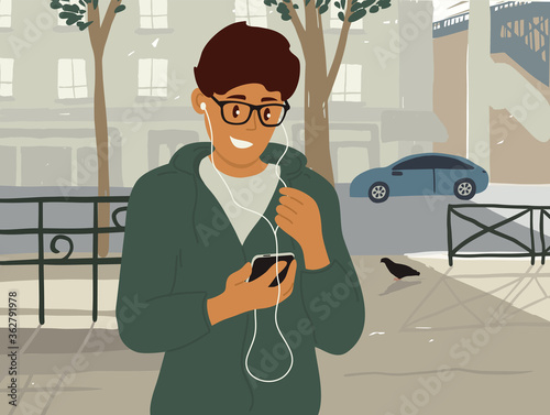 Young man in earphones makes online video call, browses internet on smartphone. Smiling guy walking along summer city street listening to music or podcast. Talking by mobile phone vector illustration