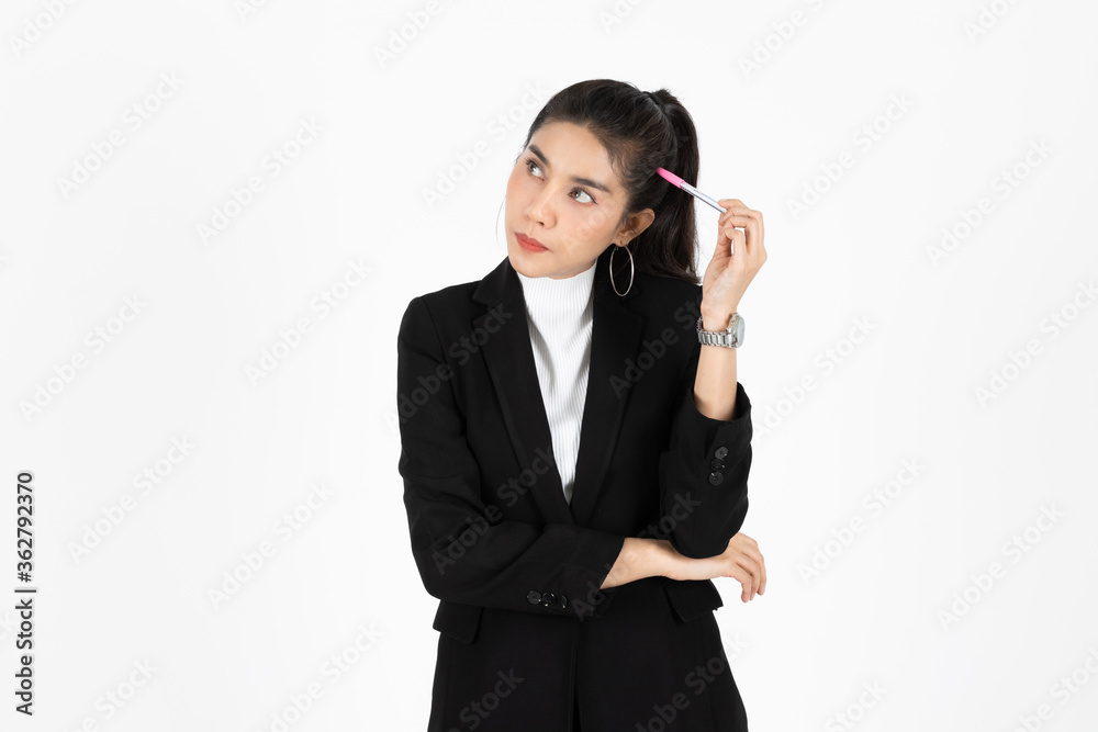 Portrait of attractive young Asian business woman holding pen and having idea posing over white isolated background. Portrait of attractive young Asian business woman holding pen and having idea posing over white isolated background.
