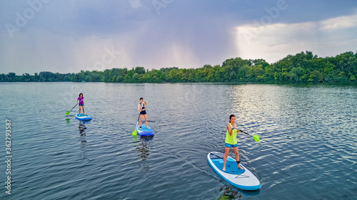 Photography Active family on SUPs, standing up paddleboards, in river water, summer family s