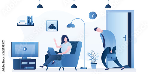 Sad and tired employee returns home from work. Apartment interior with furniture. Wife or girlfriend greets unhappy businessman.