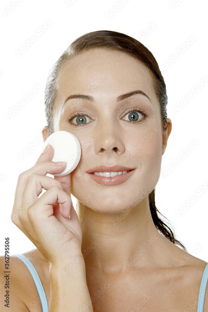 Woman cleaning her face Woman cleaning her face