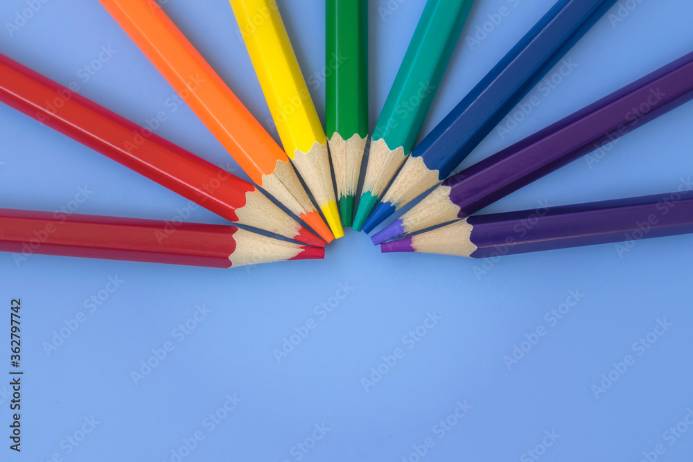 Colored pencils are laid out with rainbow colors and LGBT. Goods for study and development. Art. Painting.